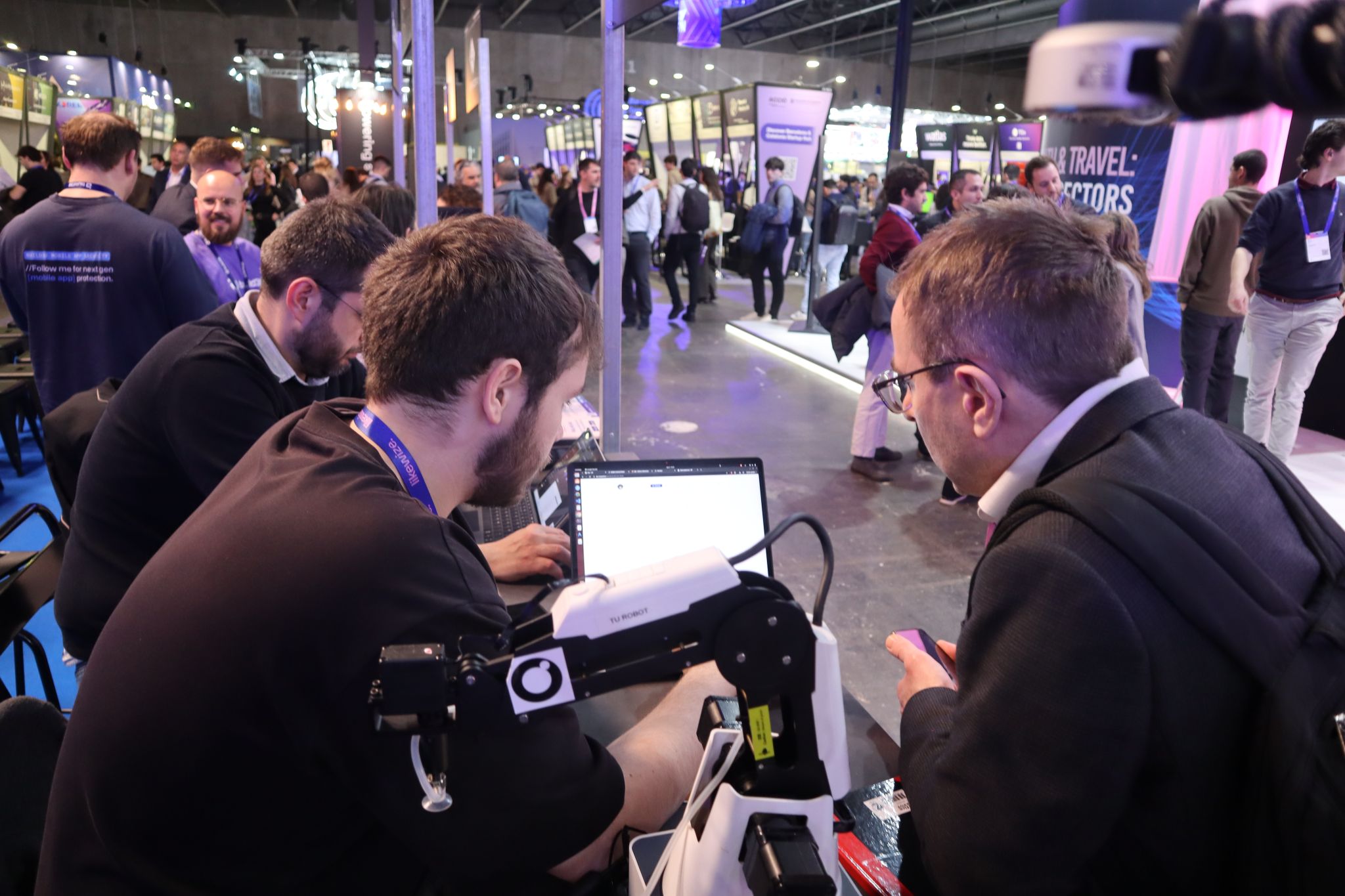 Rosepetal AI long cat plushie mascot at MWC stand.